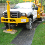 Desmond Well Drilling Rig drilling a well water at a customers home.